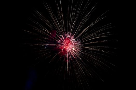 Red Yellow Sparkling Fireworks Background on Night Scene. Abstract color fireworks background and smoke on sky