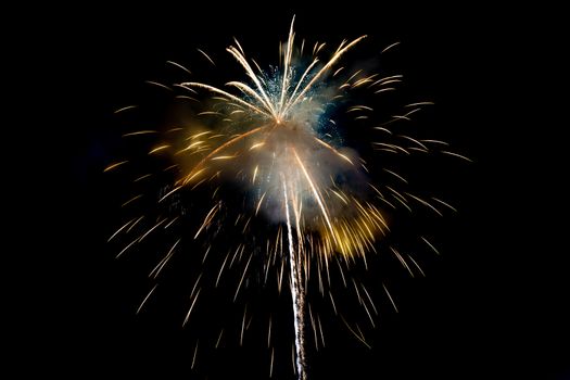 Yellow Sparkling Fireworks Background on Night Scene. Abstract color fireworks background and smoke on sky