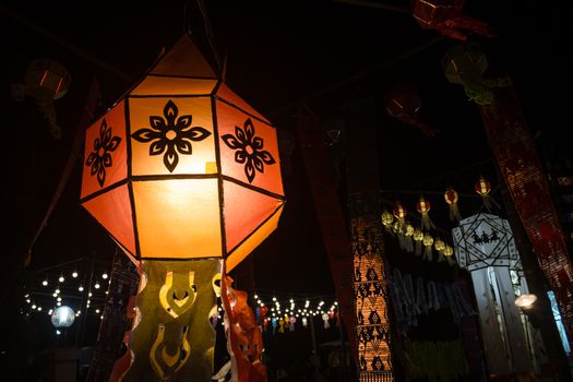 Orange Paper lanterns in Loi Krathong festival on Left Frame. Lanterns contest in Loi Krathong festival at Phayao Thailand