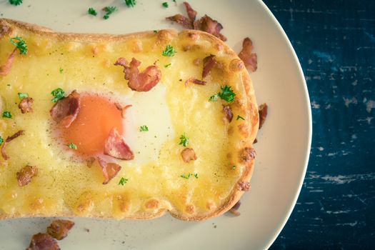 Egg Yolk Bacon Ham Cheese Toast and Coriander. Breakfast egg yolk bacon ham cheese with bread toast with coriander on top for food and drink category