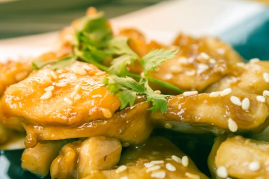 Fried Chicken with Garlic and Pepper and Coriander in Dish with Natural Light on Center Frame in Vintage Tone