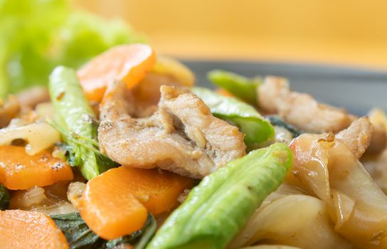 Stir Fried Noodle and Pork and Carrot and Yardlong Beans and Lettuce with Black Soy Sauce with Natural Light in Zoom View