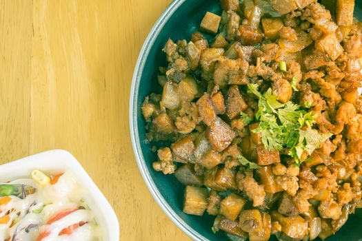 Stir Fried Pork with Onion and Garlic and Black Soy Sauce and Coriander Topping and Tofu and Vegan Salad on Right Frame and Flaylay View in Vintage Tone