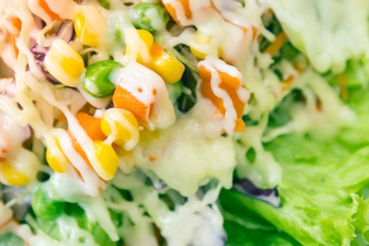 Vegan or Vegetarian Salad with Mayonnaise Topping on Left Frame include Carrot and Tomato and Corn and Cabbage and Peas and Lettuce in Vintage Tone