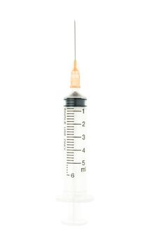 Plastic orange syringe isolated on white background on vertical view. Single use medical tool in hospital for injection.