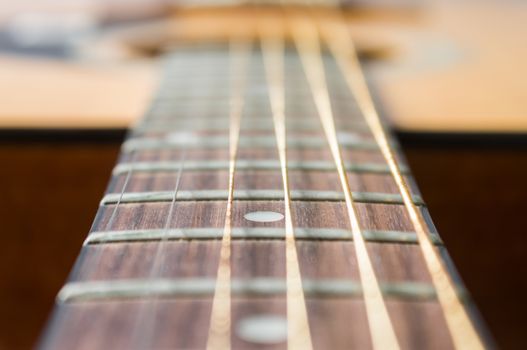 Fingerboard and Inlay of 6 String Brown Wood Acoustic Guitar in Zoom View