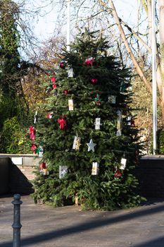 Beautiful christmas tree with gift boxes and shopping bags 