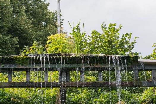 Small weir waterfall in a public park