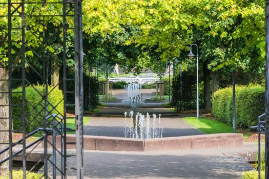 Small weir waterfall fountain in a public park