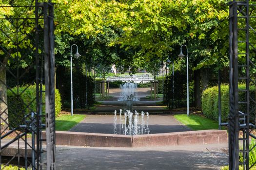 Small weir waterfall fountain in a public park