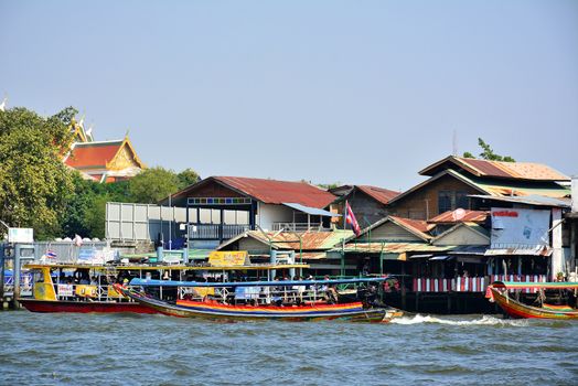 BANGKOK, TH - DEC. 12: Tha Tien ferry boat station terminal on December 12, 2016 in Chao Phraya River, Bangkok, Thailand.
