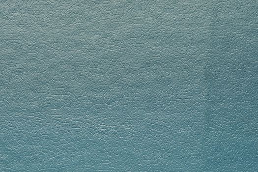 Synthetic blue leather for background. Close-up detail macro photography view of texture decoration material, pattern background design for poster, brochure, cover book and catalog.