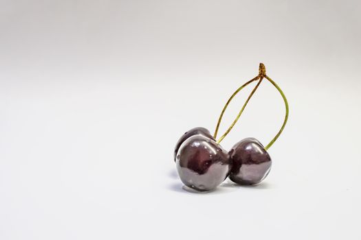 red cherries on a white background