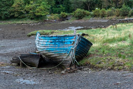 An old rowboat, abandoned on the dried up river bank.
