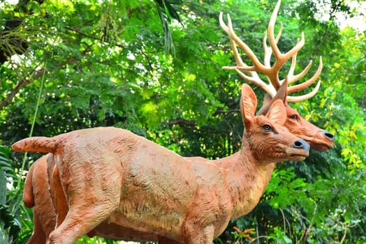 BANGKOK, TH - DEC 13: Deers statue at Dusit Zoo on December 13, 2016 in Khao Din Park, Bangkok, Thailand. Dusit Zoo is the oldest zoo in Bangkok, Thailand.