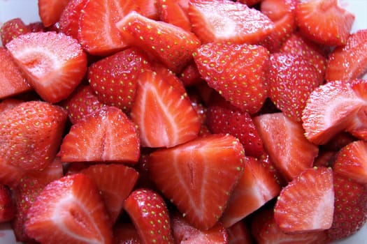 A portion of sliced fresh yummy red strawberries