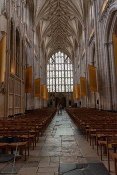 Winchester, England--July 17, 2018. Looking down the center aisle of England's Winchester Cathedral from front to back.