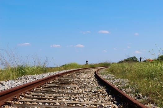 Old railway with blue sky and clouds. Beja, Portugal.