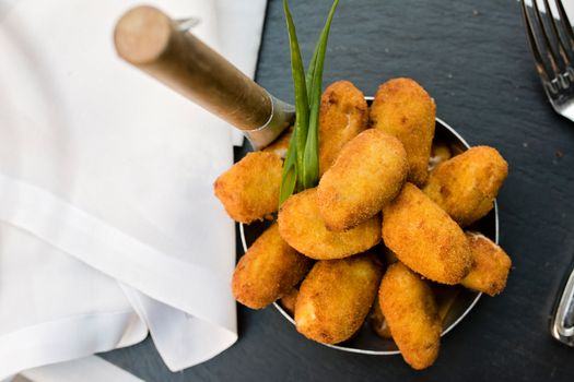 Spanish croquettes, breaded, and fried in olive oil.