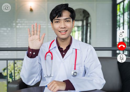 video conference screen Doctor look at camera are greet patients via video call. Doctors are using telemedicine technology to interact with patients for remote patients and keep social distancing