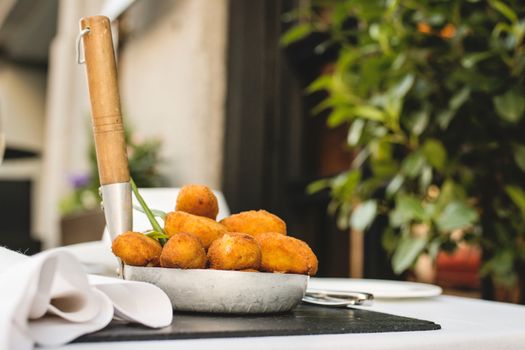 Spanish croquettes, breaded, and fried in olive oil.