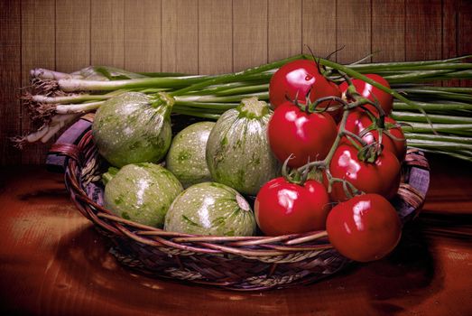 Vegetables brought from the bazaar in a basket lie on a shelf in the kitchen