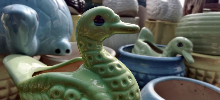 Green duck garden porcelain pot for sale inside the plant nursery in New Delhi, India