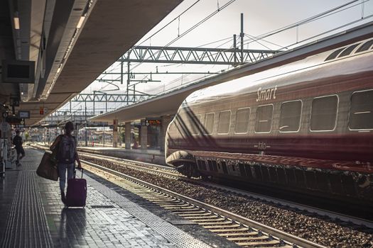 PADOVA, ITALY 17 JULY 2020: Padua railway station with train and people