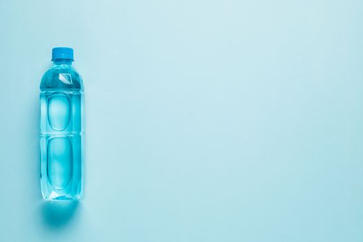 Water bottle on blue background for drinking and beverages concept