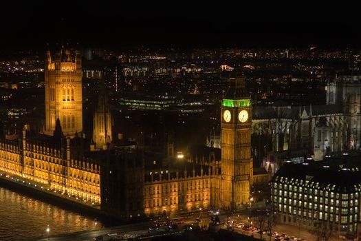 Aerial view of lights on Thames, Illuminated Big Ben and Houses of parliament