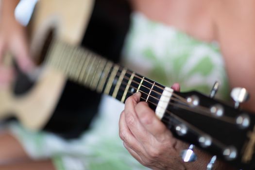 Woman Playing Ccoustic Guitar Abstract..