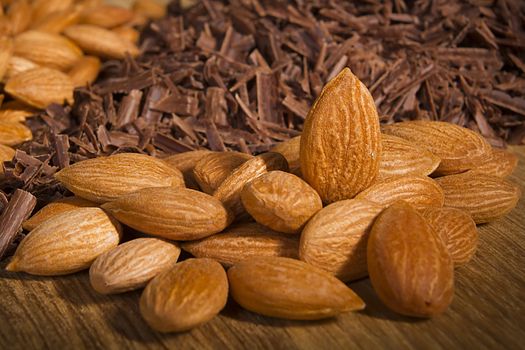 Almond nuts and delicious grated chocolate closeup