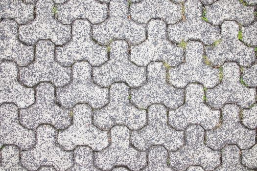 Gray paving slabs on the road