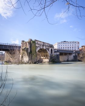 Emilio bridge or Ponte Rotto, ancient Roman bridge over the Tiber river, near the Isola Tiberina island in Rome, Italy