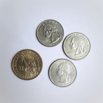 One dollar and quarter coin is placed in white chart background