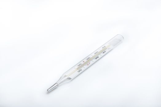 medical thermometer on white background with copy space.
