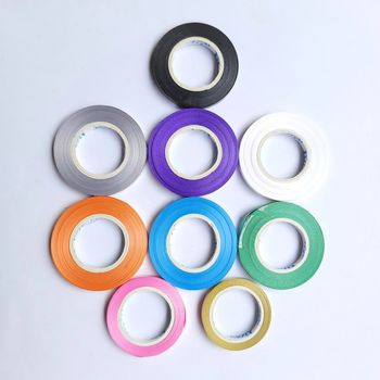 Multi colored curling ribbon arranged beautifully in white chart as backgrounds