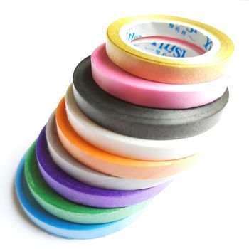 Multi colored curling ribbon arranged in diagonal shape beautifully in white chart as backgrounds
