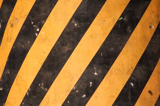 Grunge Road Markings For Pedestrians With Yellow And Black Paints texture.
