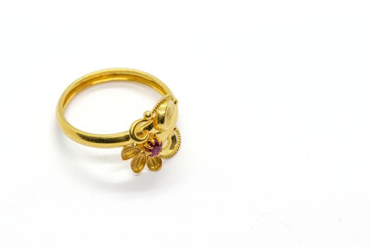 one red stone gold lady ring design for anniversary on the white background