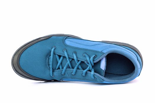 right cheap simple blue hiking or hunting shoe isolated on white background - view from above.
