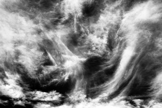 Cloudscape background texture of black and white dramatic monochrome cirrus clouds stock photo