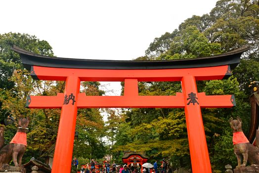 KYOTO, JP - APRIL 10 - Fushimi Inari Taisha shrine Japanese gate torii on April 10, 2017 in Kyoto, Japan. Fushimi Inari was dedicated to the gods of rice and sake by the Hata family in the 8th century.