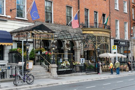 Dublin, Ireland--July 16, 2018. A hotel and restaurant with bicycles parked out front.