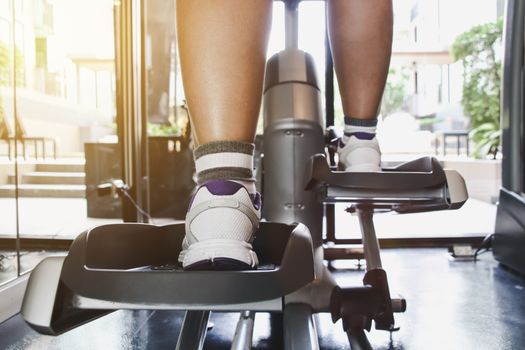 woman exercise workout on machine in gym.Concept of fitness.