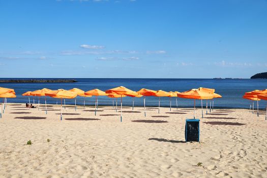 Varna, Bulgaria - July, 13, 2020: beach umbrellas on an empty beach in Bulgaria