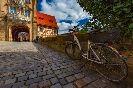 BAMBERG, GERMANY - SEPTEMBER 23, 2014: Bamberg city in Germany. Town hall building in background with blue cloudy sky.  Architecture and travel in Europe.