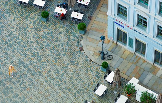 DRESDEN, GERMANY - SEPTEMBER 22, 2014: Top down view on street of Dresden, state of Saxony, Germany, Europe. Restaurant and people down below.