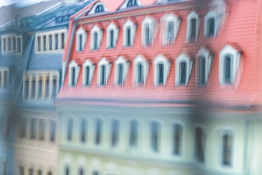 Tiled house roof with window in Dresden, Germany. Old town architecture of Europe.