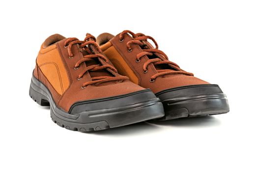 a pair of brown cheap durable fabric travel shoes isolated on white background.